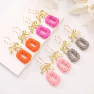 Exaggerated bow earrings with rose embossed oval pendants in four assorted colors