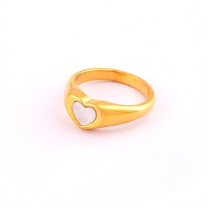 Detail of 18K gold plated ring featuring a heart-shaped mother of pearl inlay on white