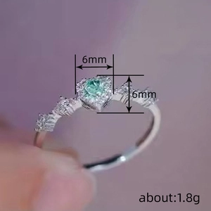 Exquisite double heart emerald ring with green gemstone and diamond accents