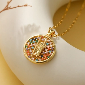 Macro view of 18K gold plated Mary pendant with colorful zircon stones and hollow design