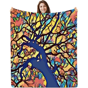 Woman holding a large skull tapestry with colorful stained glass abstract art patterns