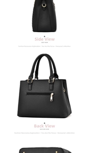 Detail of black lychee grain leather handbag with gold hardware and back zipper pocket