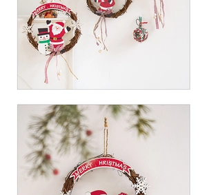 Macro detail of natural rattan Christmas wreath with plush Santa and Merry Christmas sign
