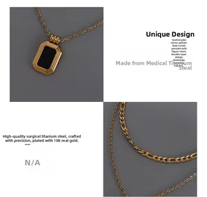 Detail of 18K gold-plated double-layer necklace with black acrylic rectangle pendant