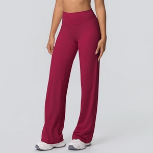 Macro detail of high-waisted flared yoga pants with smooth brushed fabric and elastic texture