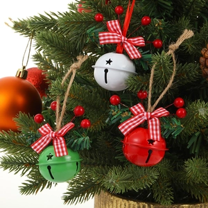 Christmas metal bells with red berries, plaid bows and jute rope in red, white and green