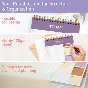 Detail of purple daily planner featuring flexible coil and 120gsm paper interior pages