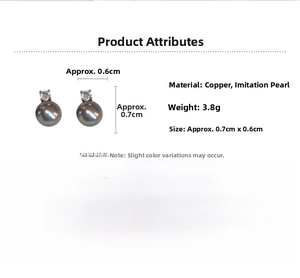 Detail view showing gray faux pearl stud earrings with zirconia on copper base