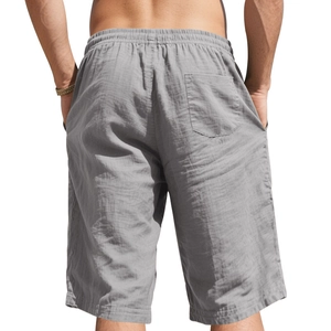 Rear view of grey linen shorts for men with elastic waistband and breathable fabric texture