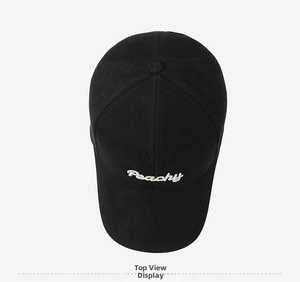 Top view of black cotton baseball cap with white Peachy embroidery and six-panel design