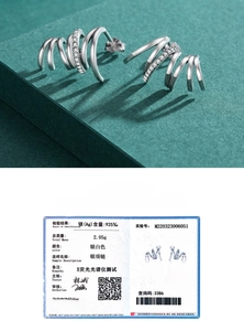 Macro detail of S925 sterling silver hoop earrings with spiral design and cubic zirconia