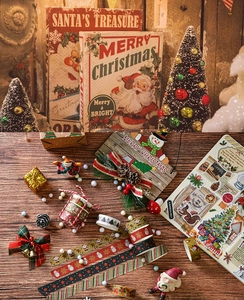 Detail showing vintage Christmas washi tape rolls with Santa and gift box stationery