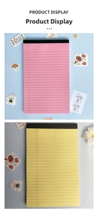 Detailed view of pink and yellow A5 legal pads with easy-tear lined pages for daily planning