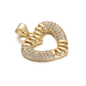 Detail of gold-plated hollow heart pendant with evil eye and sparkling cubic zirconia