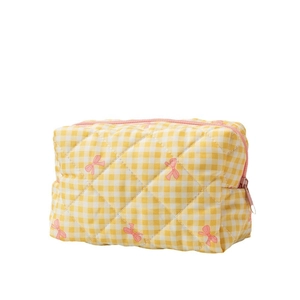 Quilted yellow checkered cosmetic bag with pink bow patterns and top zipper closure