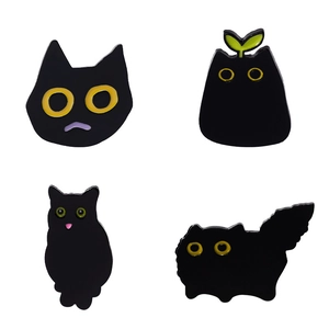 Set of four minimalist black cat enamel pins featuring diverse cute feline designs and poses