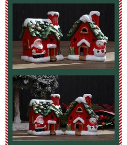 Detailed view of ceramic Christmas house ornaments with Santa and snowman motifs