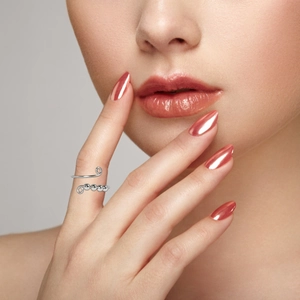 Close-up of a silver rotatable bead ring for women with adjustable open design