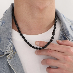 Mens black twisted rope chain necklace made of durable titanium steel shown on male model