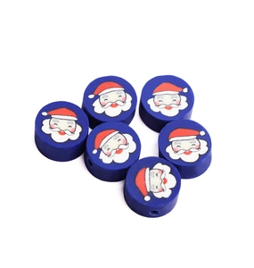 Detailed view of six blue round clay beads with Santa Claus face for DIY jewelry making