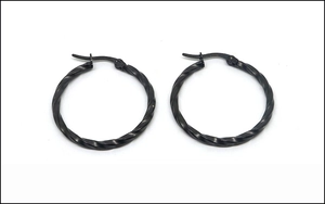 Detail shot of black twisted hoop earrings with a textured matte finish for women