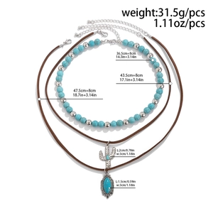 Detailed view of bohemian layered necklace set with turquoise beads and cactus pendant