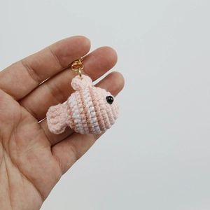 Handmade crochet pink clownfish keychain with white stripes and golden metal ring