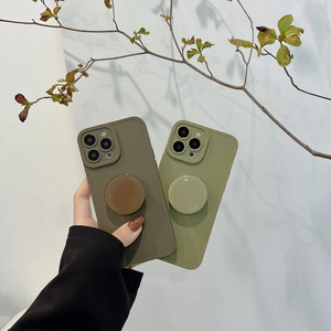 Close-up of matte iPhone case in army green and grey with integrated round kickstand