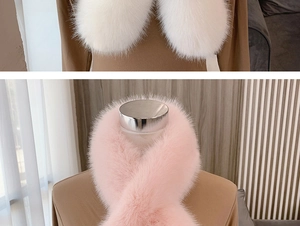 Detail view of white and pink faux fox fur scarves showing soft texture and cross design