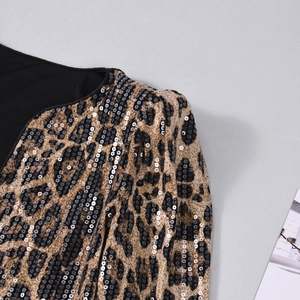 Detail of leopard print sequins on the shoulder and neckline of a long-sleeve blazer