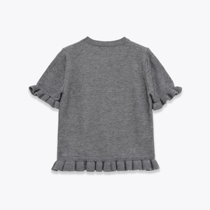 Detail of grey short sleeve knit sweater with ruffled edges and round neckline on white background