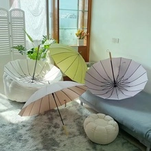 Minimalist sun umbrellas in pastel colors displayed in a modern home living room scene