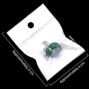 Green pumpkin-shaped gemstone pendant with silver loop in a 9x6cm plastic bag