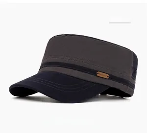 Detail of navy blue military flat top cap with leather logo patch and stitched side strap