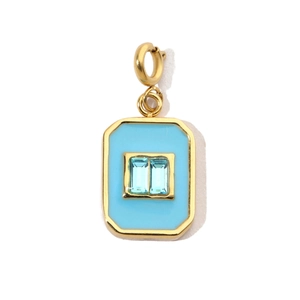 Detail of a light blue rectangular gemstone pendant with golden stainless steel frame