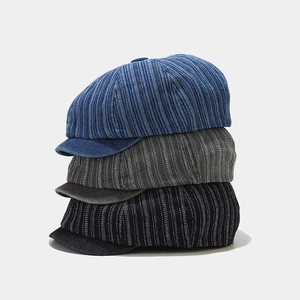 Three vintage denim newsboy caps in blue grey and black with vertical stripes