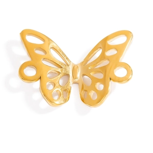 Macro detail of golden butterfly pendant with hollow-out design and polished finish