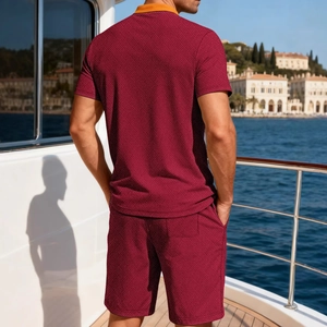Men burgundy waffle polo set with yellow collar on luxury yacht deck view