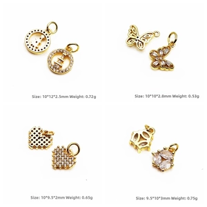 Detailed view of four butterfly and clover charms with micro-pave cubic zirconia settings