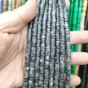 Close-up of grey natural stone disc beads strands for DIY jewelry making accessories