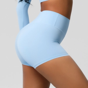 Close-up of light blue high-waisted yoga shorts with butt-lifting seam on a model
