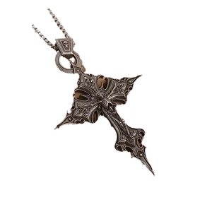 Gothic silver cross pendant necklace featuring intricate 3D relief and skull detail