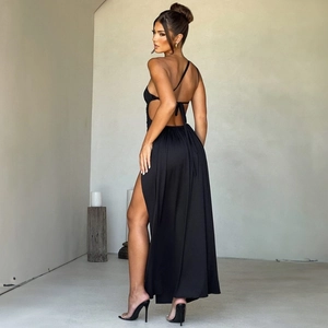 Detail of sexy backless black maxi dress featuring high slit and halter neck ties