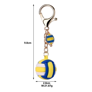 Detail view of a yellow blue volleyball keychain with metal clip and size measurements