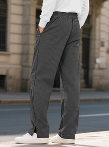 Detailed view of dark grey textured jacquard fabric on men's casual straight-leg pants