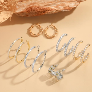 Exaggerated 14K gold plated earrings set with cubic zirconia and vintage green stones