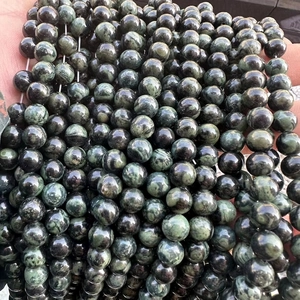 Close-up of polished natural green New Bird stone beads for DIY jewelry making