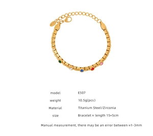 Macro detail of gold plated titanium steel bracelet featuring five colorful zircon stones