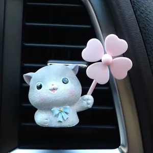 Detailed view of grey cartoon cat car air vent clip with clover fan and blue star tie