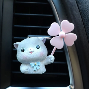 Detailed view of grey cartoon cat car air vent clip with clover fan and blue star tie